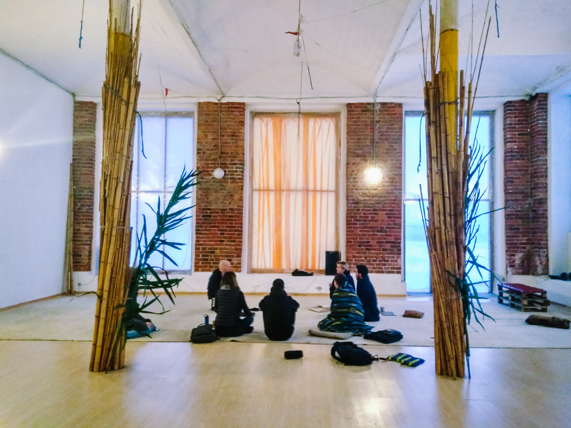 The group sitting in a recreation room