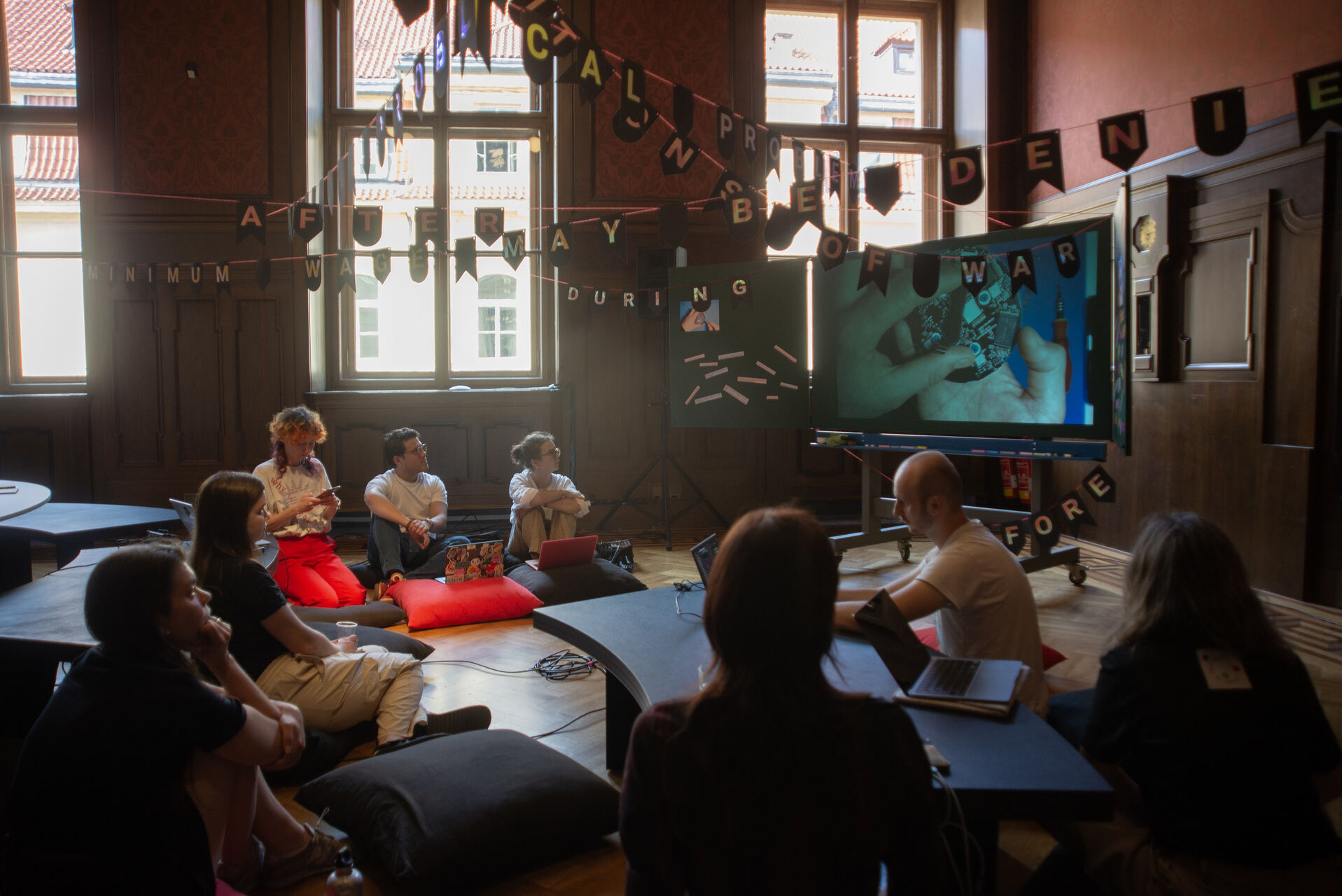 Reading session during “DATAS: The Data and the Sovereign” exhibition in Galerie Rudolfinum in Prague, 2026 / (c) GR, photo Tereza Kunderová